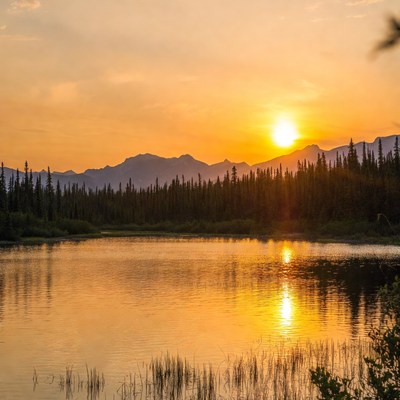Sunset over lake and mountains