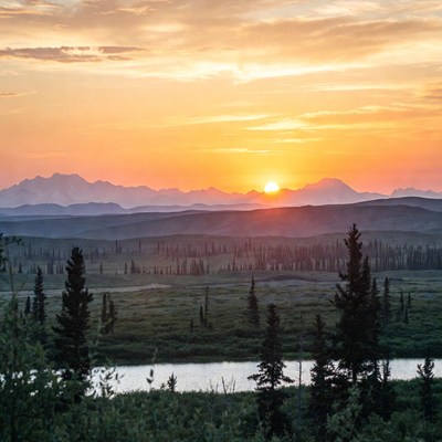 Sunset over Denali mountains and river
