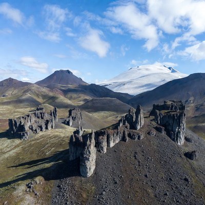 Volcanic Rock Formations Snow-Capped Mountain