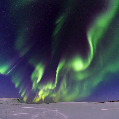 Northern Lights over Snowy Landscape