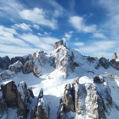 Snowy Dolomites Mountains with Blue Sky
