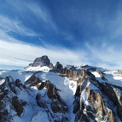 Snowy Mountain Peaks Under Blue Sky