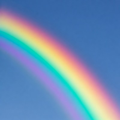 Vibrant Rainbow in Blue Sky