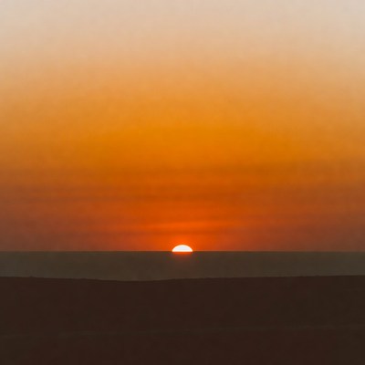 Sunset over ocean horizon