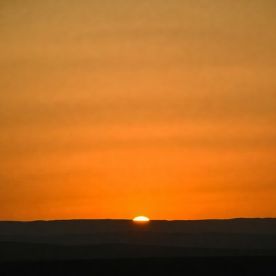 Sunset over distant mountains