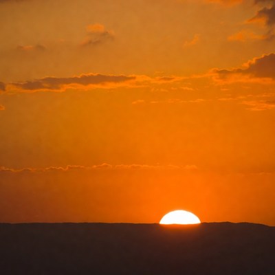 Sunset over distant mountains