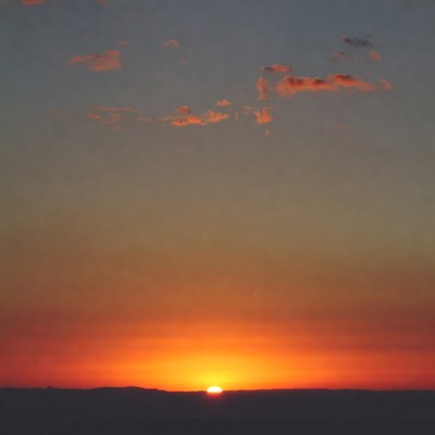 Sunset over distant mountains