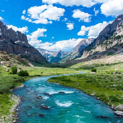 Turquoise River in Mountain Valley