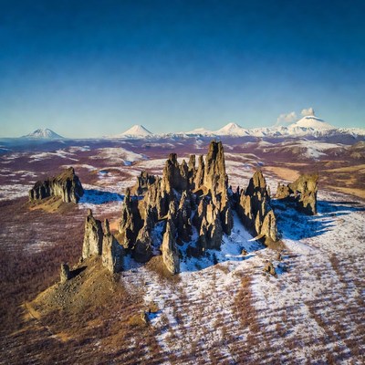 Snowy Rock Formations with Volcanoes