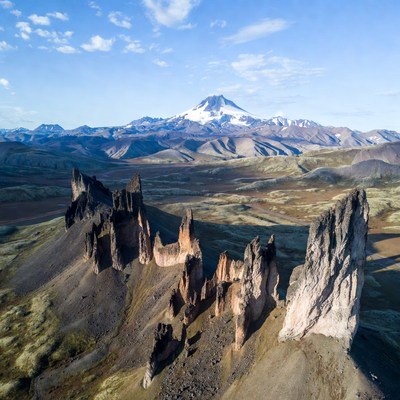 Snow-capped mountain and rock spires landscape
