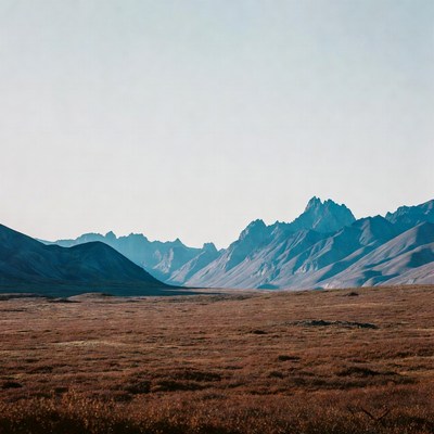 Majestic Mountain Range Over Brown Valley