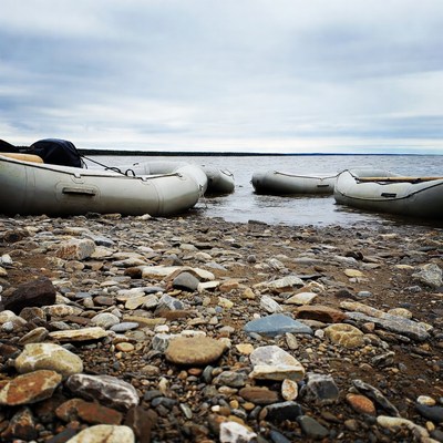 Inflatable Rafts on Rocky Lakeshore