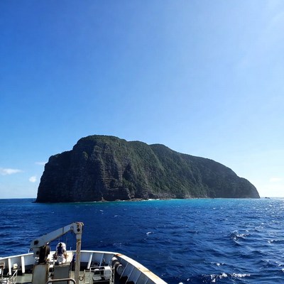 Green Cliff Island in Blue Ocean
