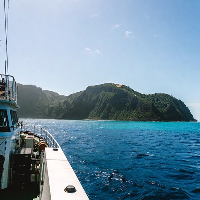 Boat Sailing Past Green Tropical Islands