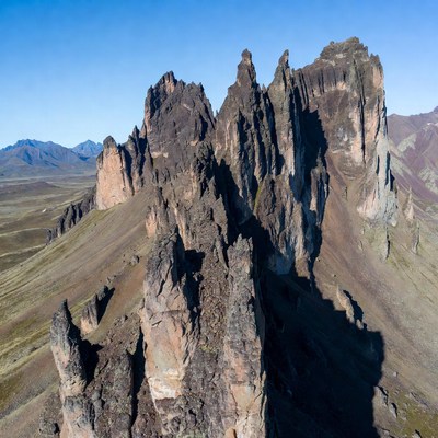 Jagged Mountain Peaks in Vast Valley