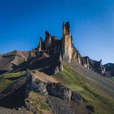 Towering Rock Formation in Mountains