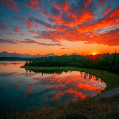 Sunset over lake and mountains