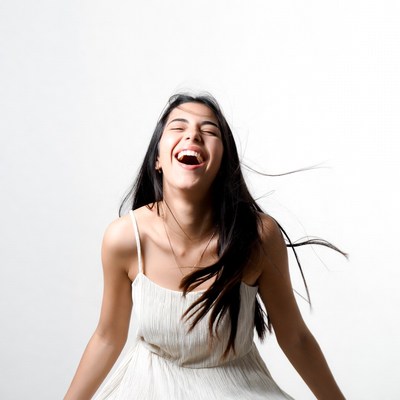 Woman laughing with flowing hair