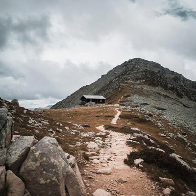 Mountain hut on rocky trail