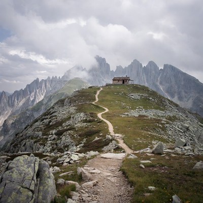 Mountain Hut on Trail with Peaks