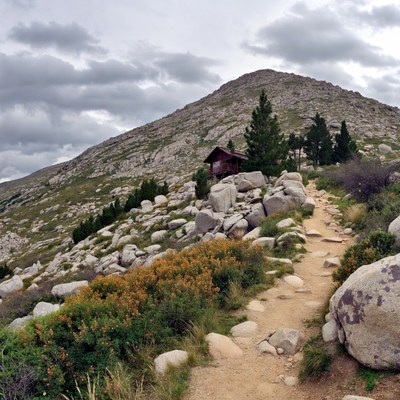 Mountain trail to wooden cabin