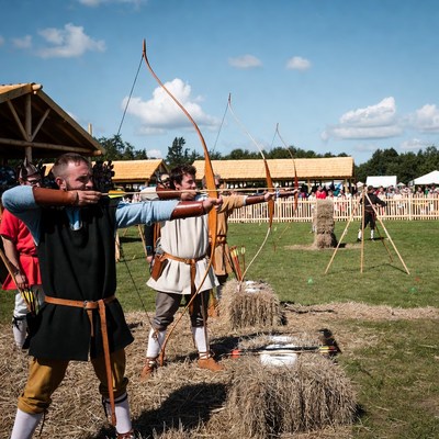 Men archers shooting bows at targets