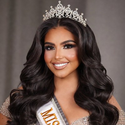 Beautiful woman wearing Miss crown and sash