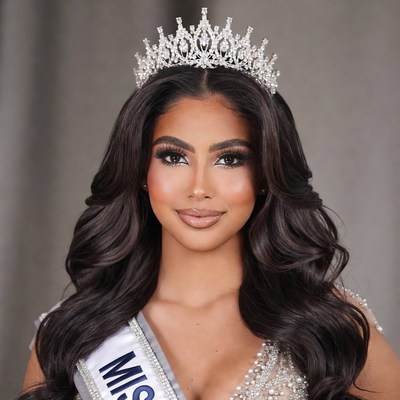 Beauty queen wearing sparkling tiara sash