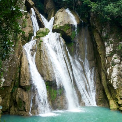 Majestic multi-tiered waterfall cascading rocks
