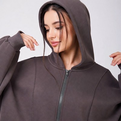 Woman in gray oversized hoodie