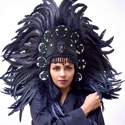 Woman wearing black feather headdress