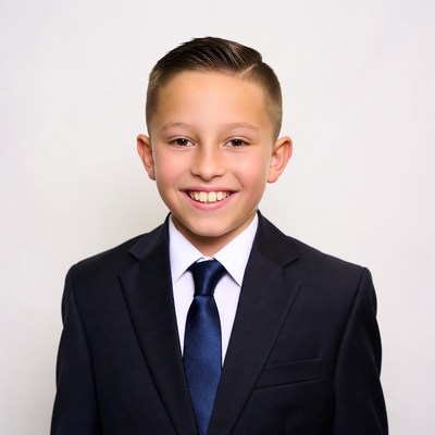 Boy smiling in navy suit