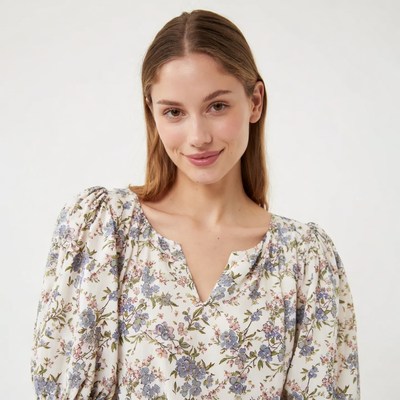 Woman in floral blouse smiling