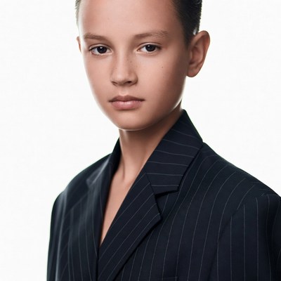 Young boy in pinstripe suit