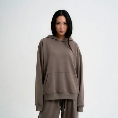 Asian woman in brown hoodie
