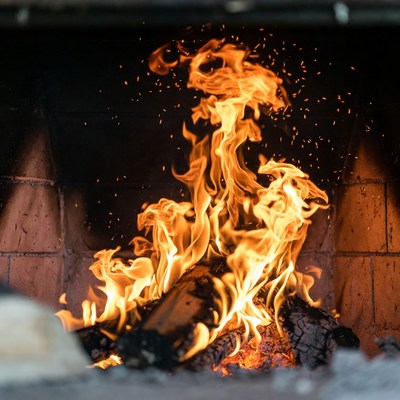 Burning Fire in Brick Fireplace