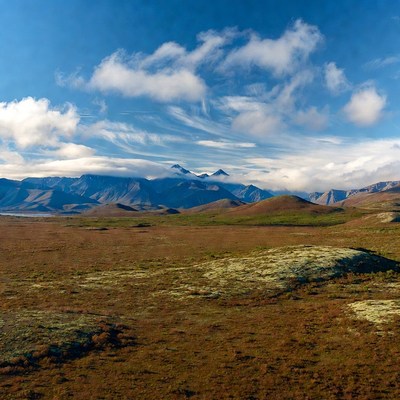 Cloudy Mountains Over Tundra Landscape