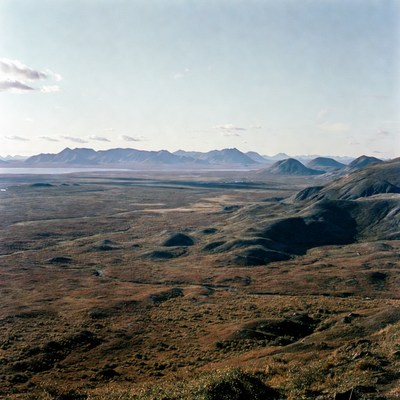 Vast tundra landscape with mountains