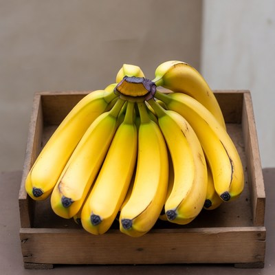 Bunch of ripe bananas in wooden crate