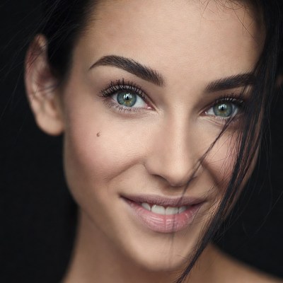 Beautiful woman with green eyes smiling