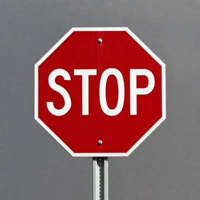 Red stop sign on pole