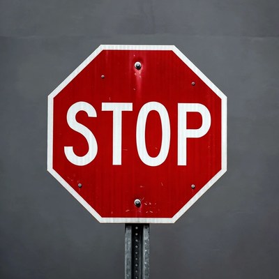 Red Stop Sign on Gray Background