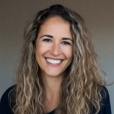 Smiling woman with curly blonde hair