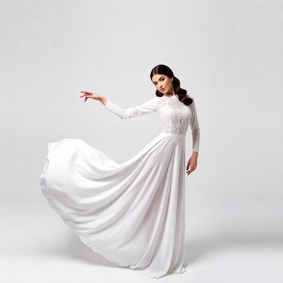 Asian woman in flowing white lace gown