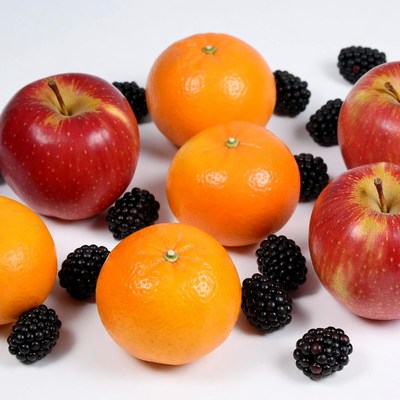 Red Apples Oranges Blackberries on White