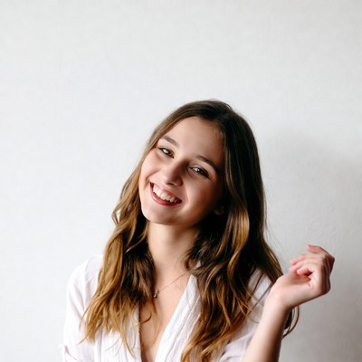 Smiling woman with wavy brown hair