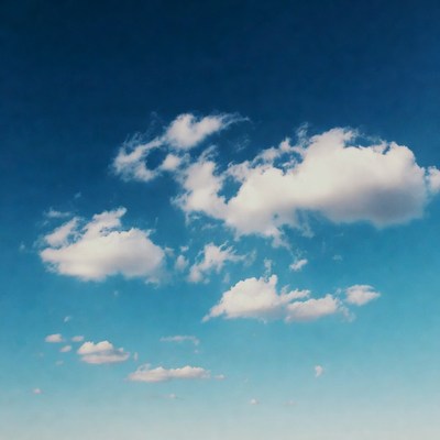 Fluffy white clouds in blue sky