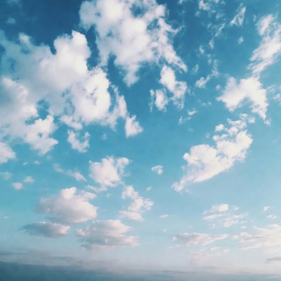 Fluffy white clouds in blue sky