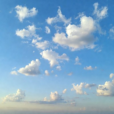 Fluffy Clouds in Blue Sky
