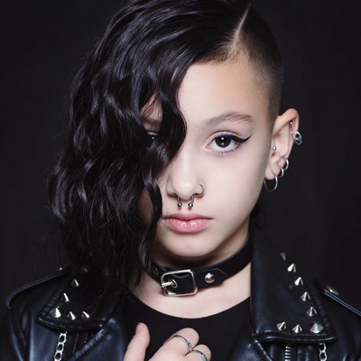 Androgynous teen with undercut hairstyle